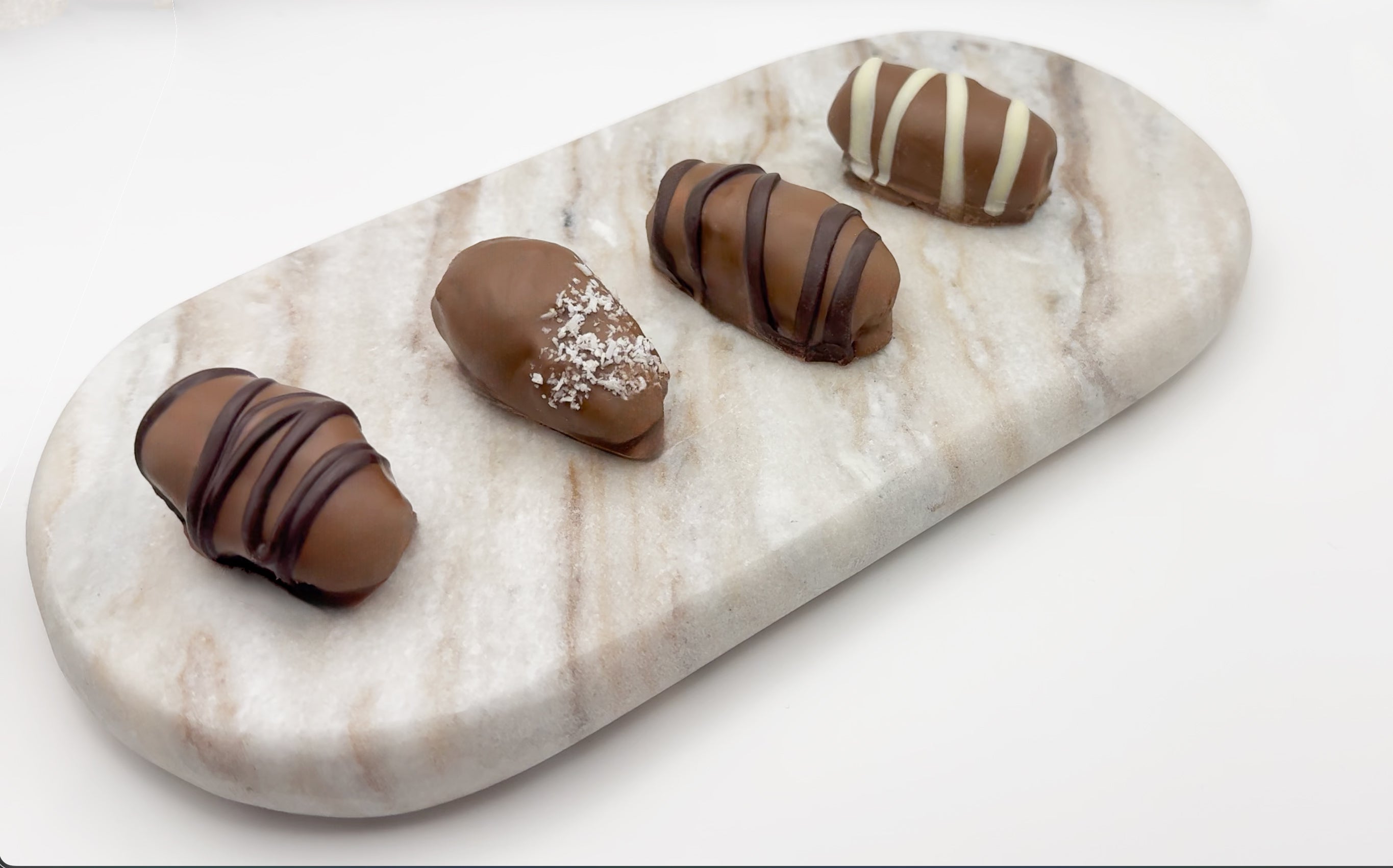Dates with Almonds coated in Chocolate